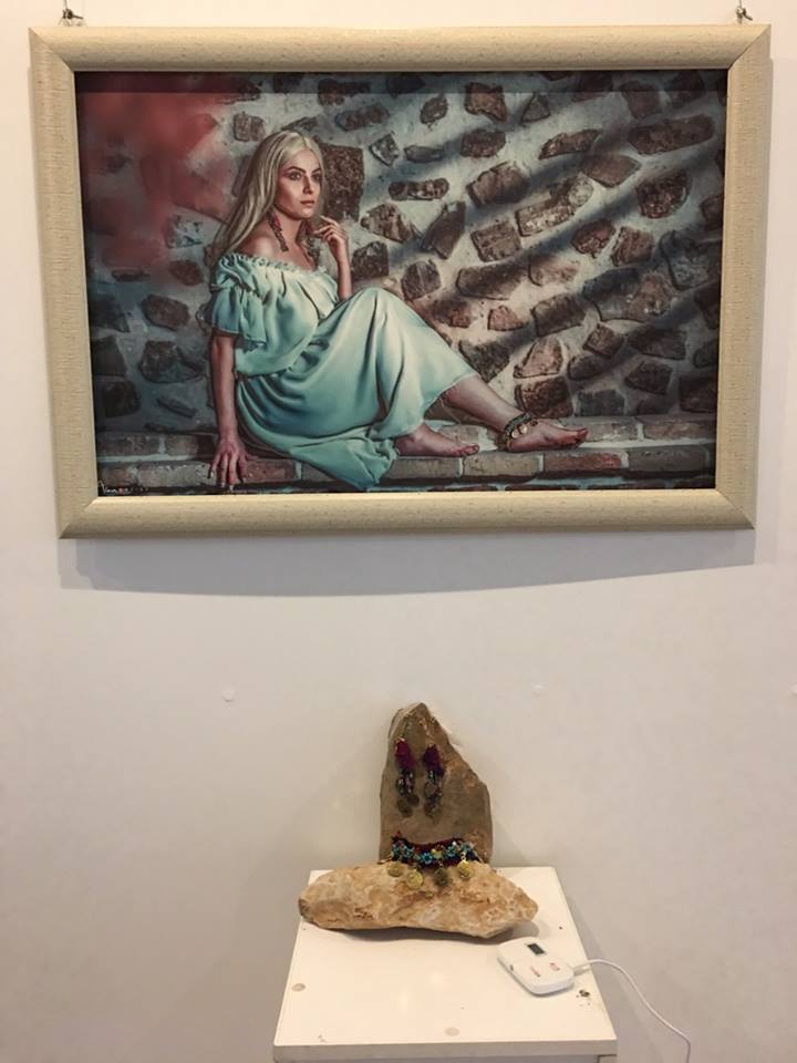 Modern artwork depicting traditional Kurdish folkore is currently on display in Erbil's Media Hall. (Photo: Kurdistan 24)